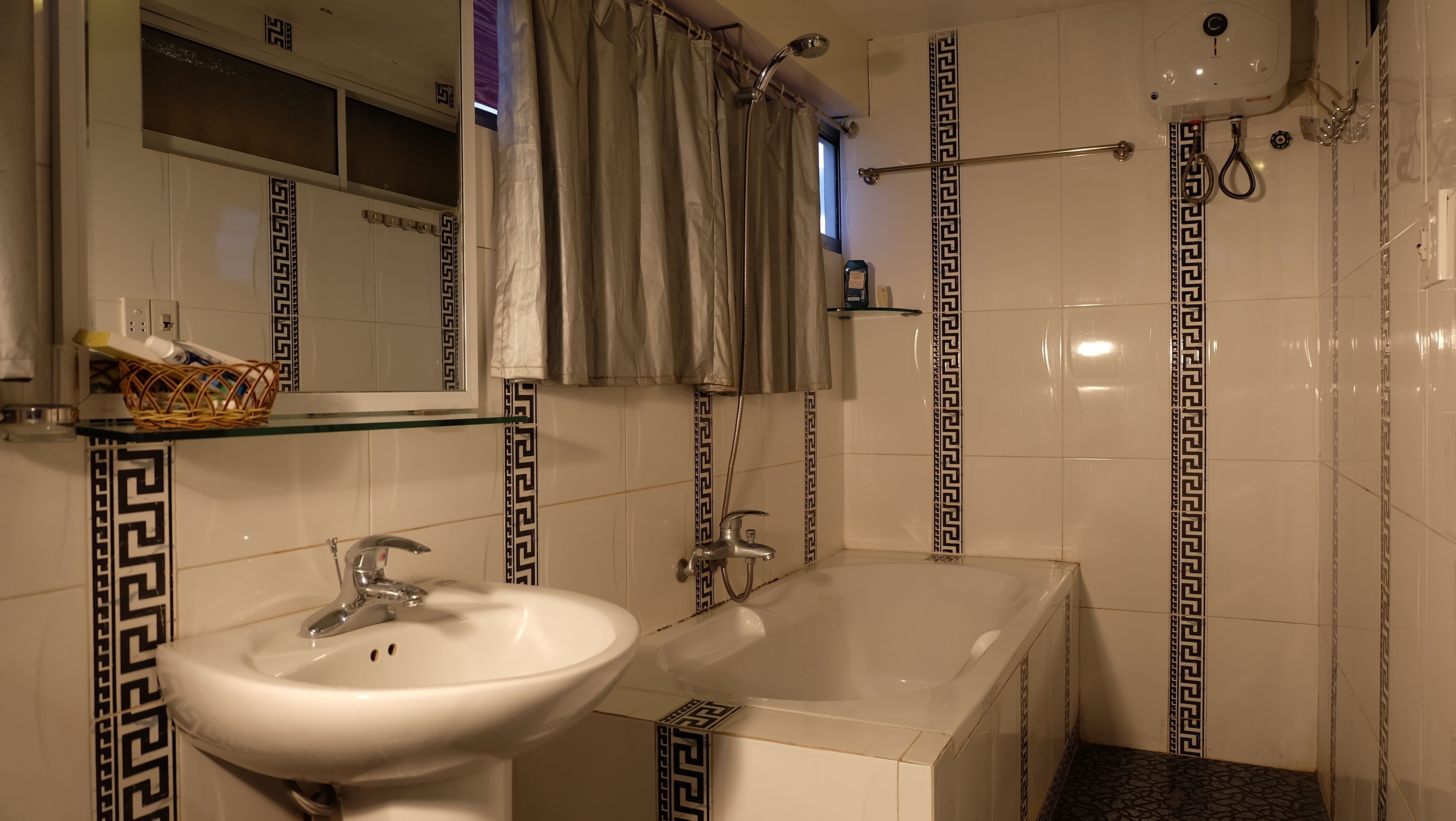 standard triple room | bathroom | deep-soaking bathtub, rainfall showerhead, free toiletries, hair dryer