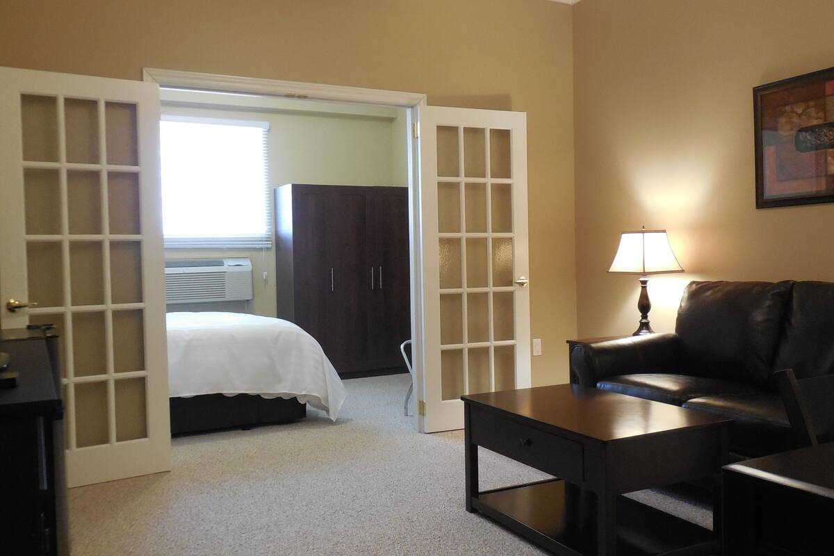 1 bedroom, premium bedding, laptop workspace, blackout curtains