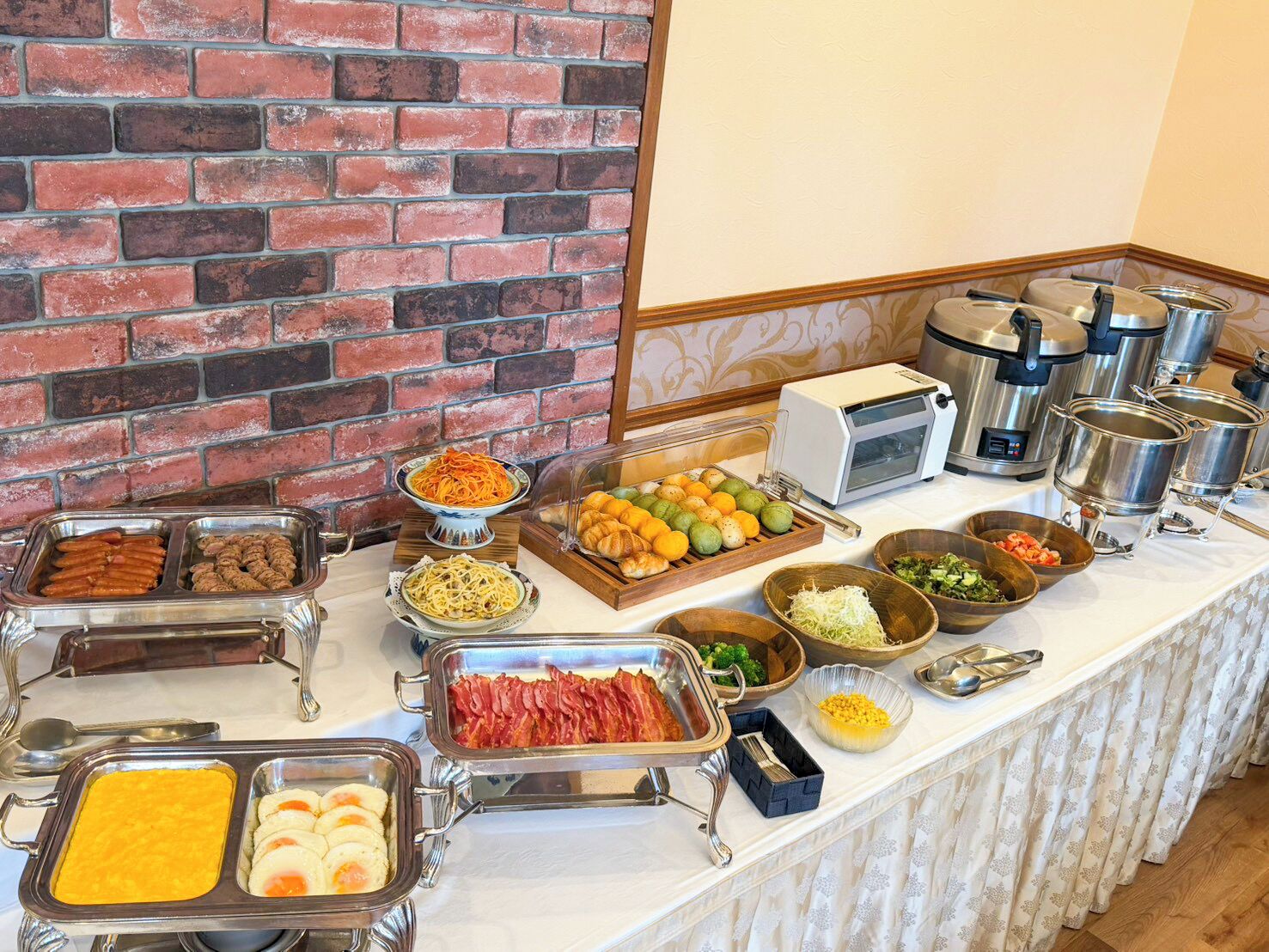 A buffet with various food items and a toaster oven.
