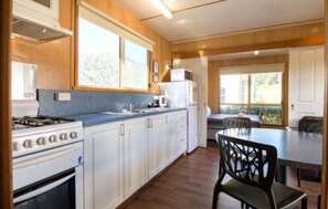 Standard 2 Bedroom Cabin | Private kitchen | Full-size fridge, microwave, coffee/tea maker, cookware/dishes/utensils