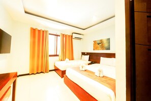A hotel room with two beds, a flat-screen TV, an air conditioning unit, and a painting on the wall. - Marianne Hotel (Puerto Princesa)
