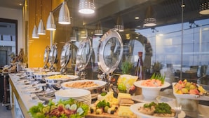 A buffet with various food items and utensils. - The Ocean Colombo (Colombo)
