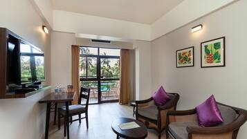 Superior Pool View | Living area | 32-inch TV with satellite channels