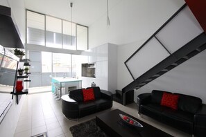 Apartment, 2 Bedrooms | Living room | Flat-screen TV