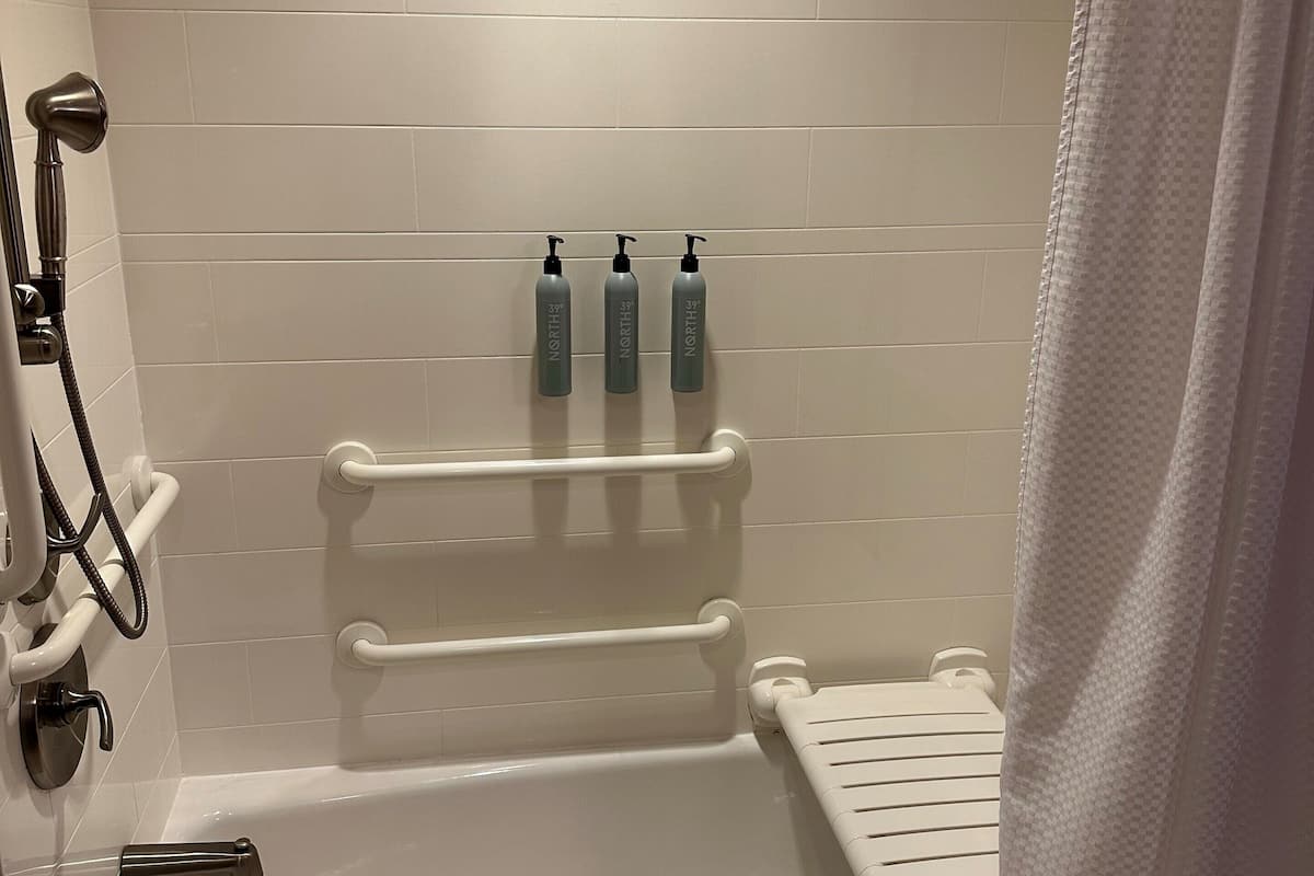 suite, multiple beds (mobility/hearing accessible, tub) | bathroom | combined shower/bathtub, hair dryer, towels