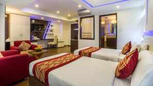 A hotel room with two beds, a desk, a chair, and a TV. - Avataar Kathmandu Hotel (Kathmandu)