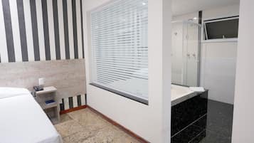 Master Suite | Bathroom | Shower, rainfall showerhead, hair dryer, towels