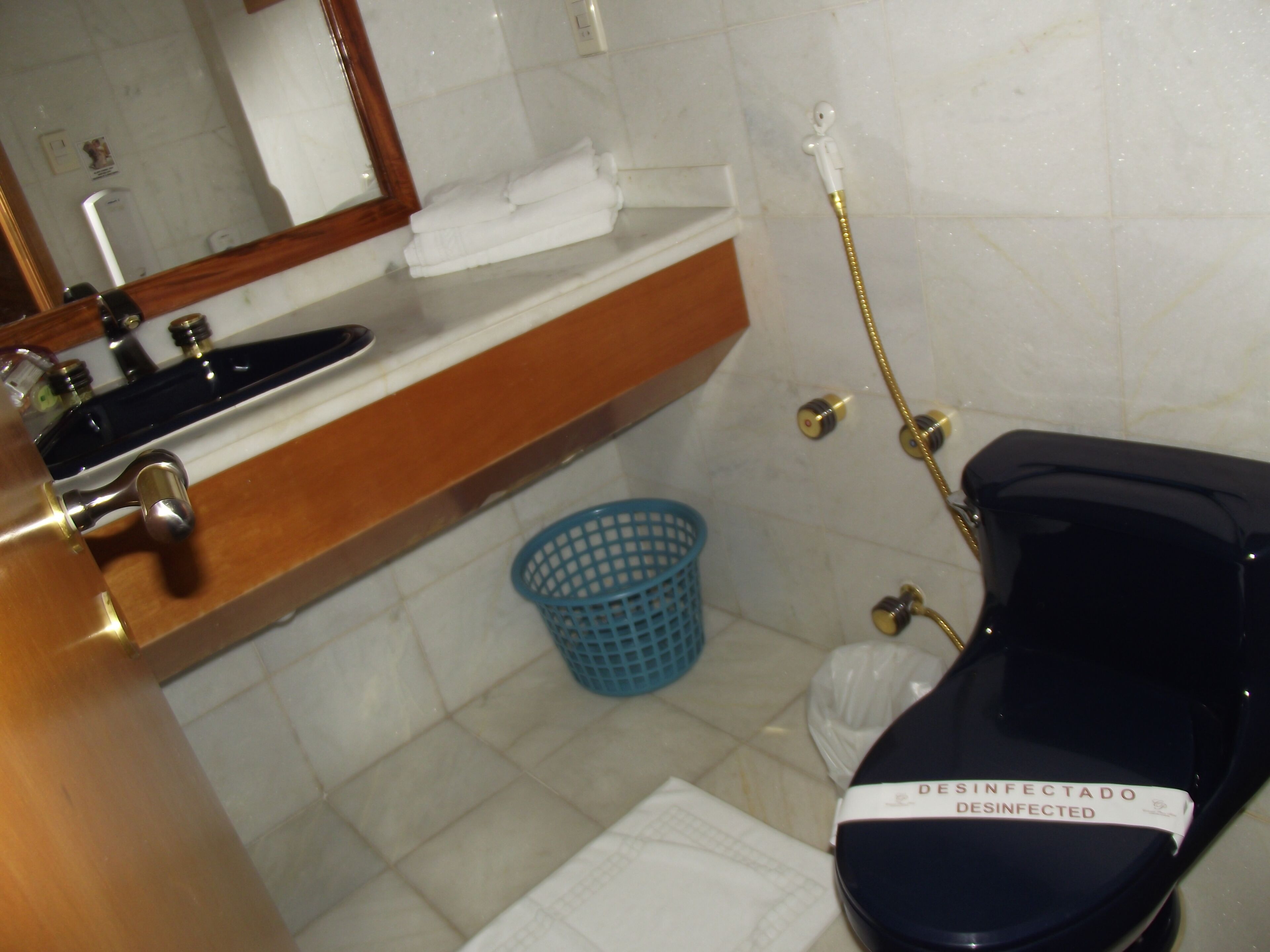 shower, rainfall showerhead, hair dryer, towels