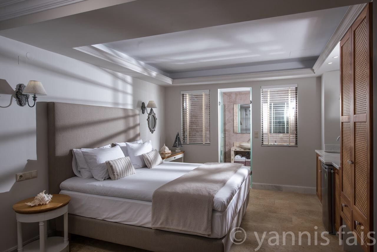 Deluxe Studio, Sea View, Ground Floor (pool front) | Pillowtop beds, in-room safe, individually decorated