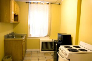Deluxe Kitchen Suite, 2 Queen Beds, Private Bathroom | In-room safe, desk, laptop workspace, free WiFi