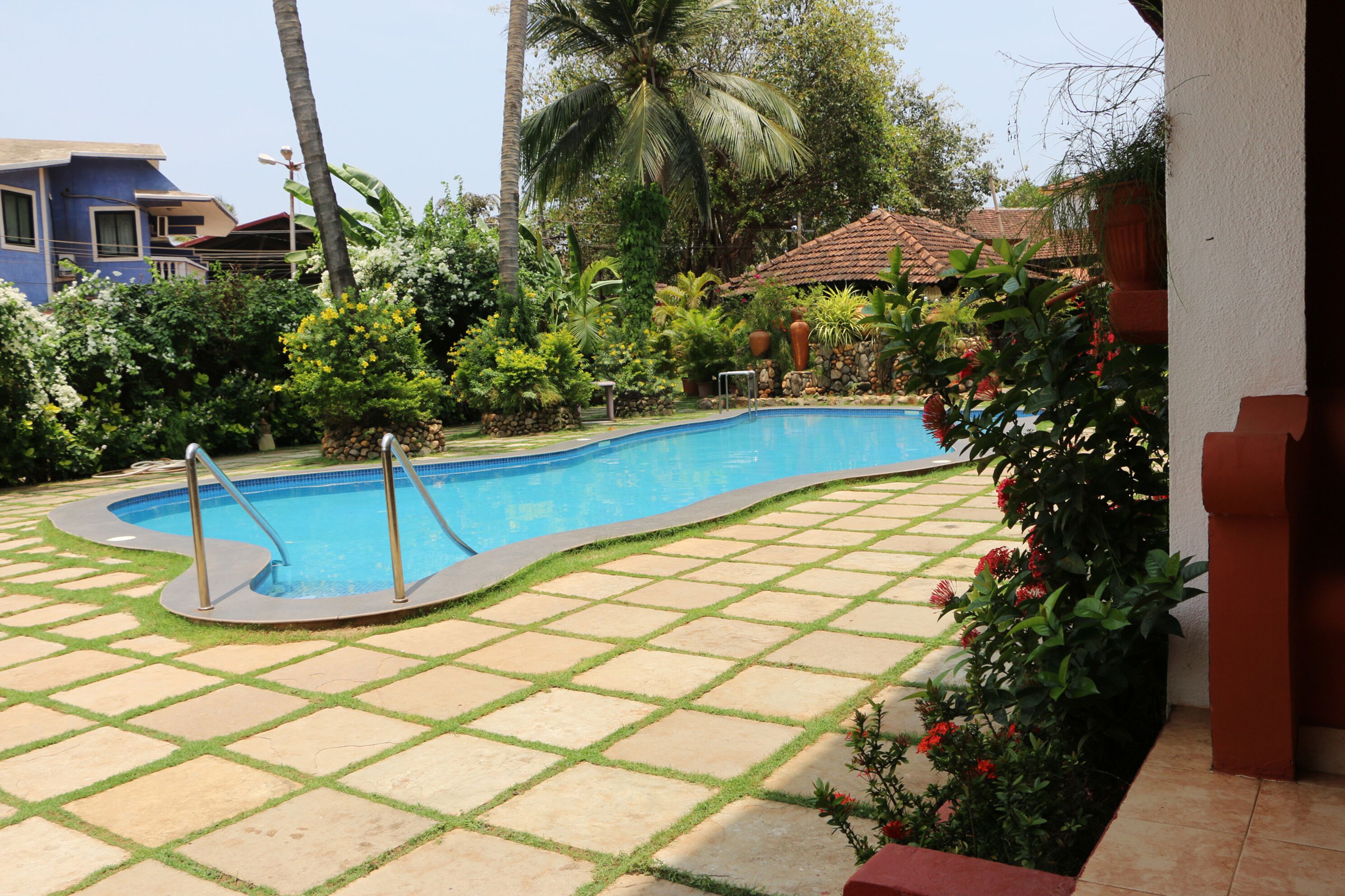 outdoor pool, open 8:00 am to 6:00 pm, pool umbrellas, pool loungers