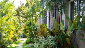 A garden pathway leading to a building with a variety of tropical plants. - The Fong Krabi Resort (Krabi)