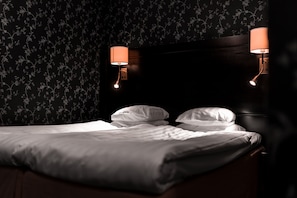 Economy Double Room, No Windows | Minibar, in-room safe, individually decorated, desk