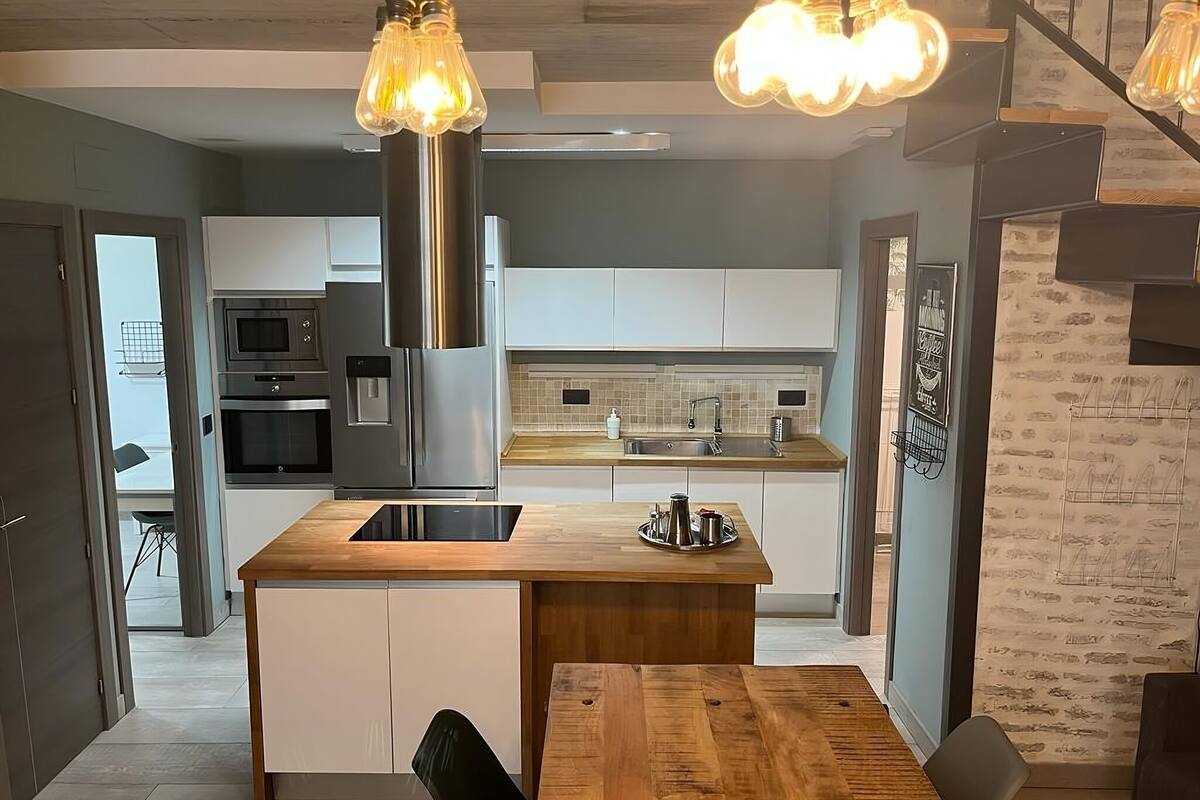 full-sized fridge, microwave, stovetop, dishwasher