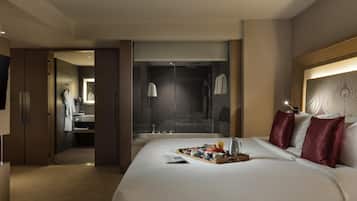 Spacious Deluxe Suite Room with Separate living area, Sofa, Bath tub and Rain Shower | In-room safe, desk, laptop workspace, iron/ironing board