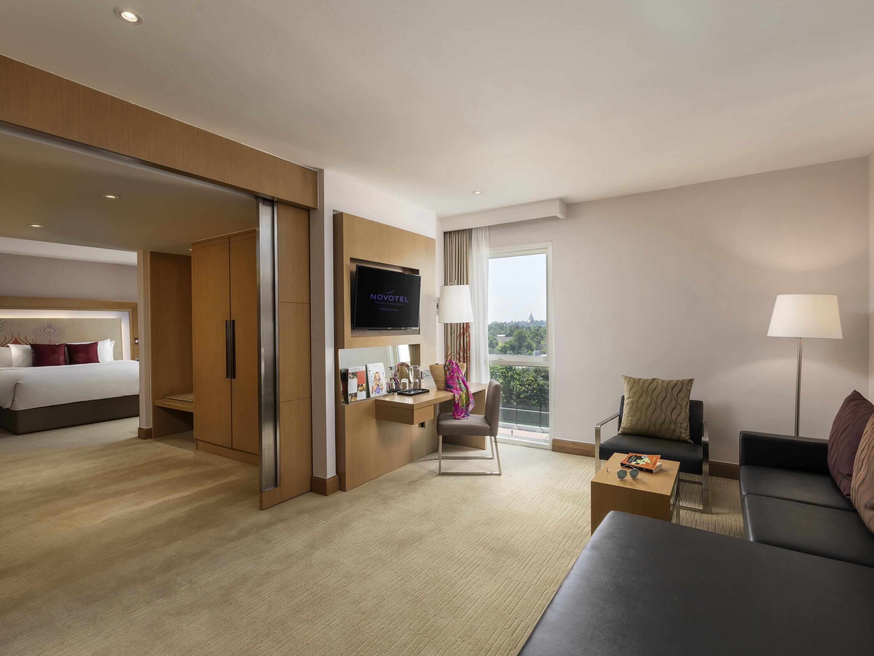 Spacious Deluxe Suite Room with Separate living  area, Sofa, Bath tub and Rain Shower | Minibar, in-room safe, desk, laptop workspace