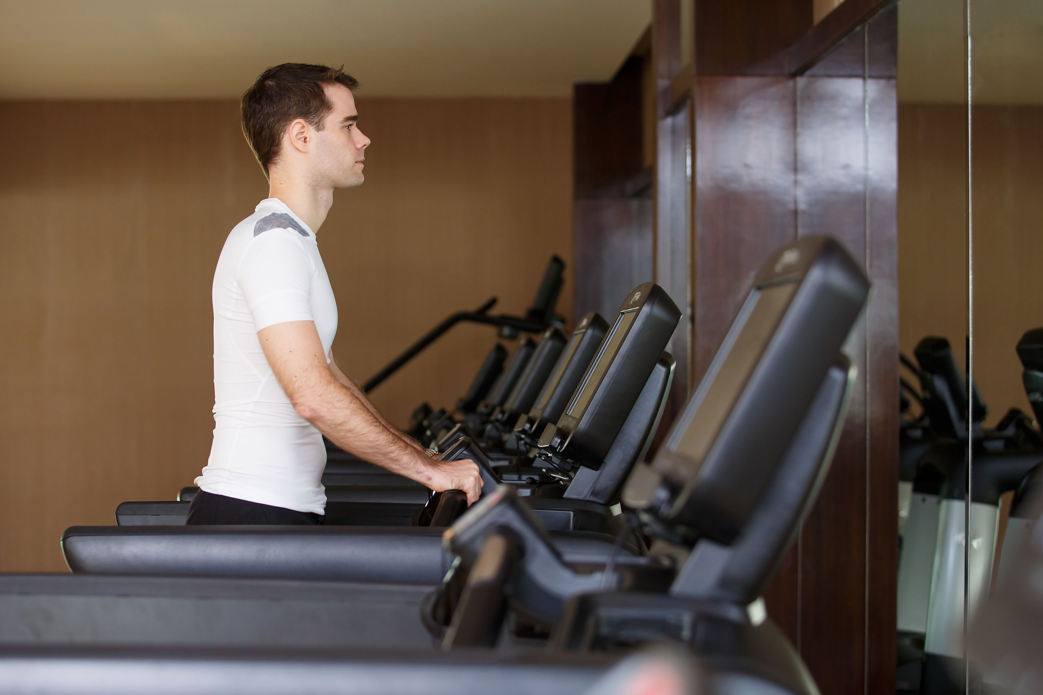 A gym with treadmills and exercise equipment.