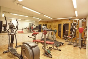 A gym with various exercise equipment including treadmills, weight machines, and free weights. - Arenal (Sant Antoni de Portmany)