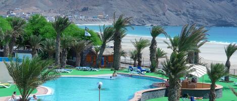 2 outdoor pools, pool umbrellas, pool loungers