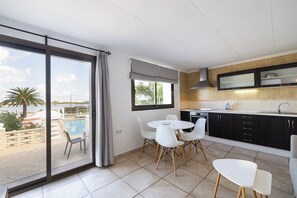Family Apartment, 2 Bedrooms, Pool Access, Sea View | Living area - El Lago Dorado (Formentera)