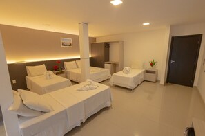 Superior Quadruple Room | Minibar, in-room safe, desk, blackout curtains