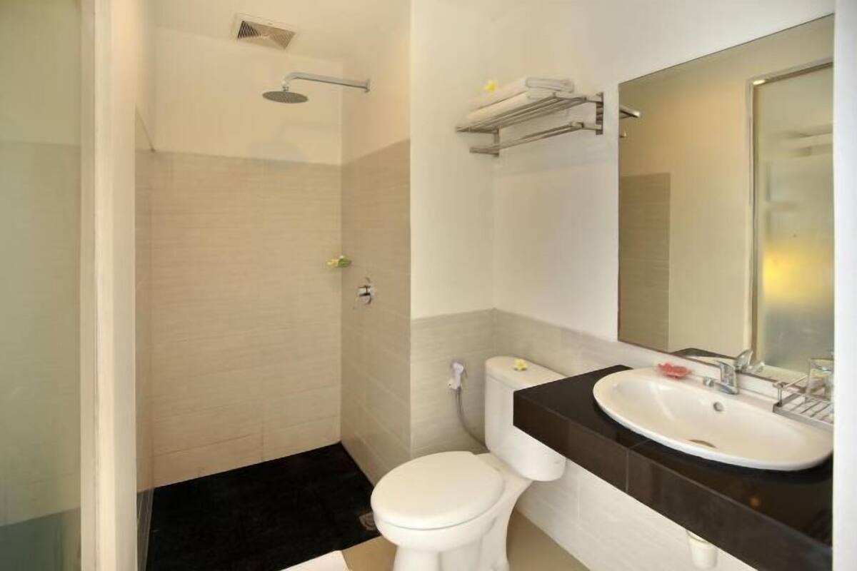 Shower, free toiletries, hair dryer, slippers