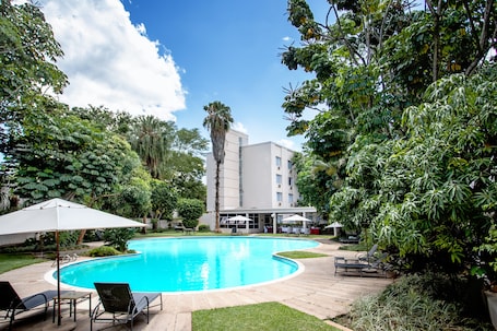 Outdoor pool, pool umbrellas, sun loungers