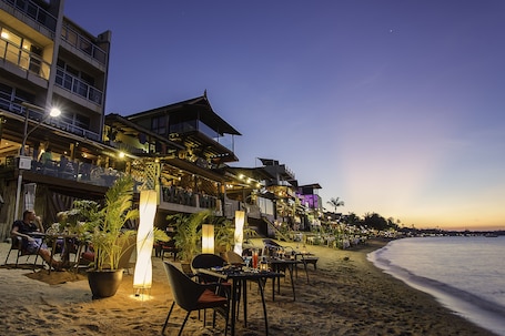 On the beach, sun loungers, beach umbrellas, beach bar