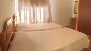 Quarto duplo | Cortinas blackout, roupa de cama