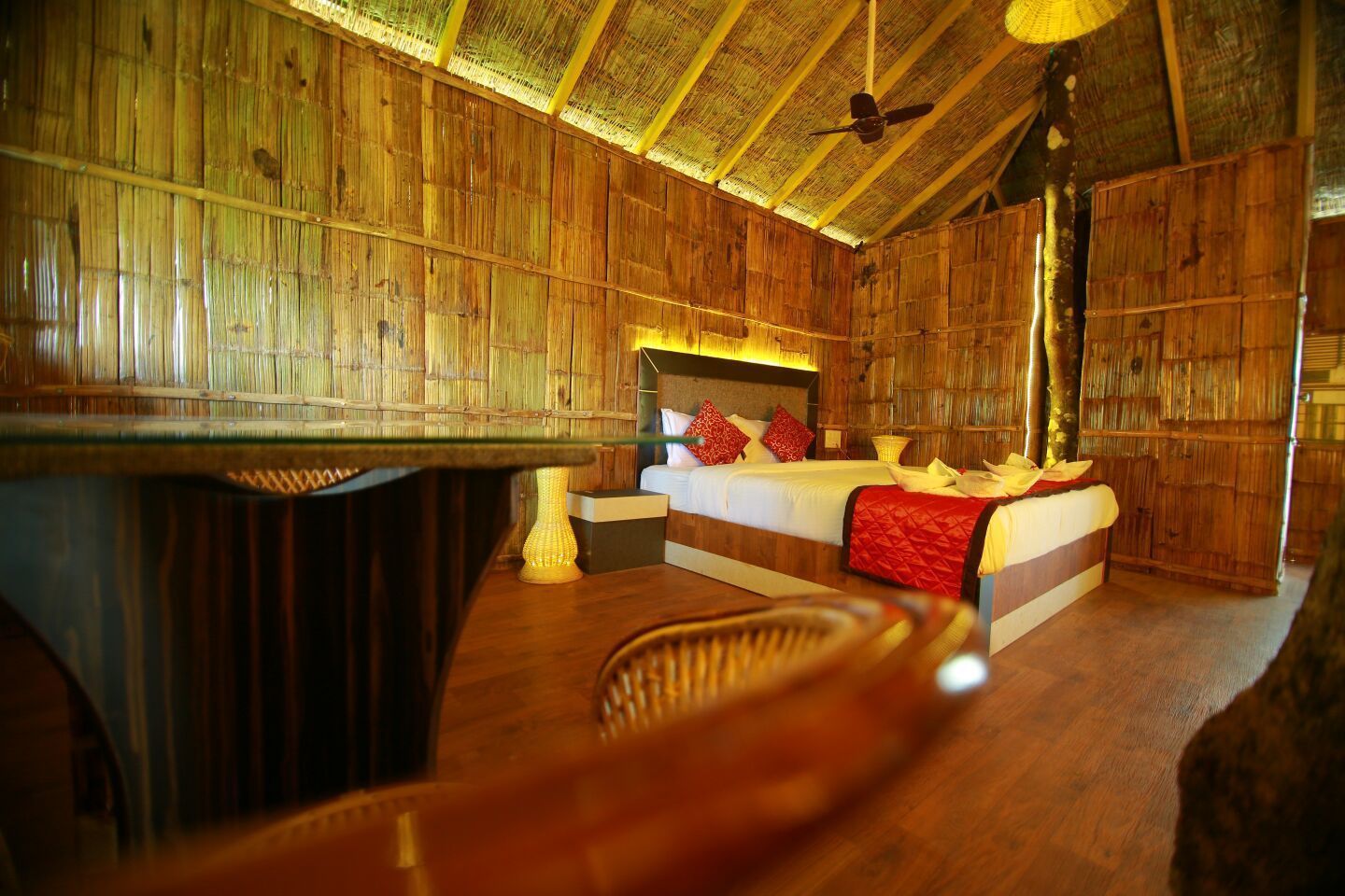 A room with a bed, a table, and a chair.