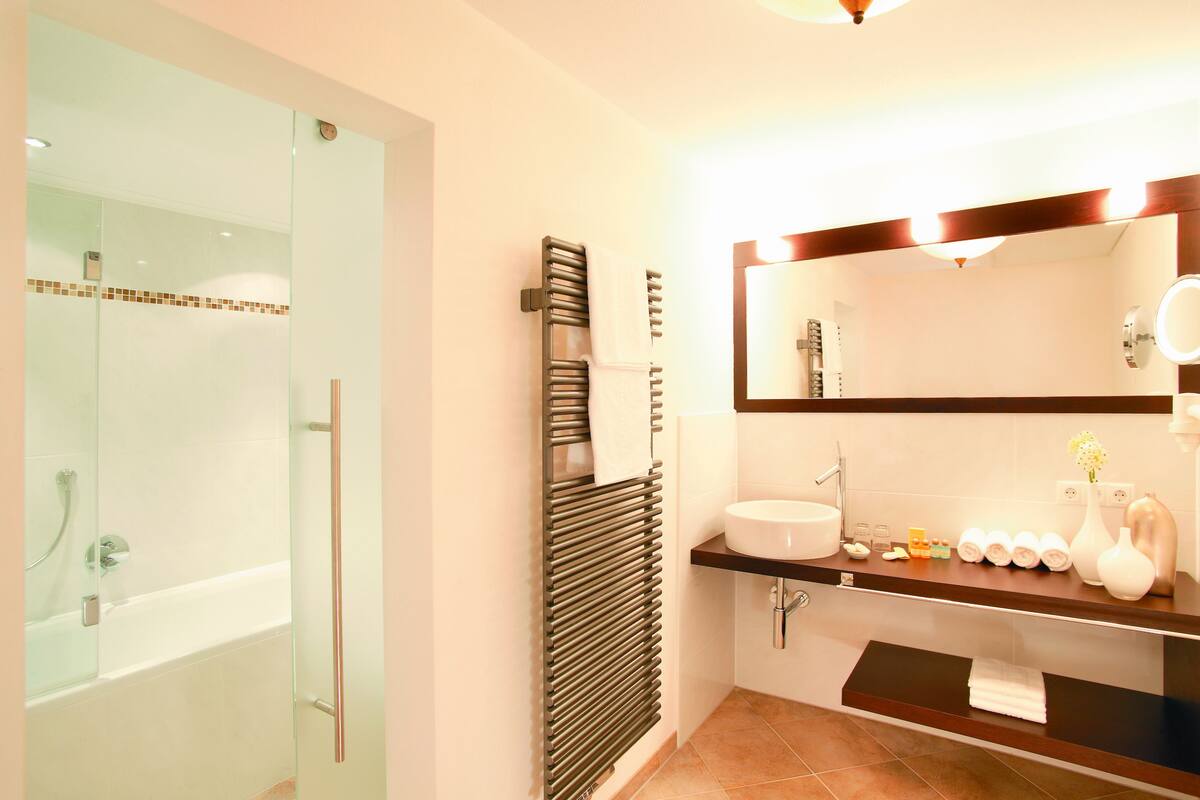 Designer toiletries, hair dryer, bathrobes, slippers