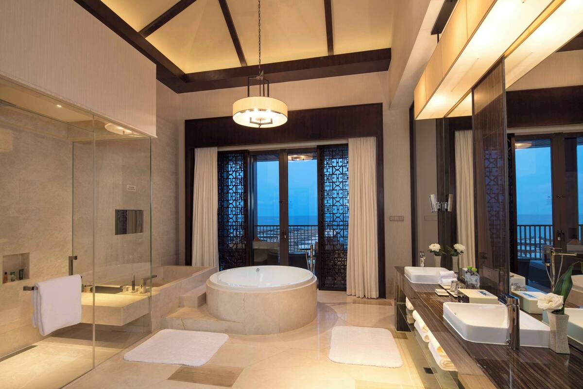 two bedroom presidential suite | bathroom | separate bathtub and shower, rainfall showerhead, hair dryer, bathrobes