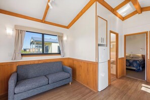 Superior 2 Bedroom Seaview Cabin - Sleeps 4 | Living area | TV - Discovery Parks - Whyalla (Whyalla)