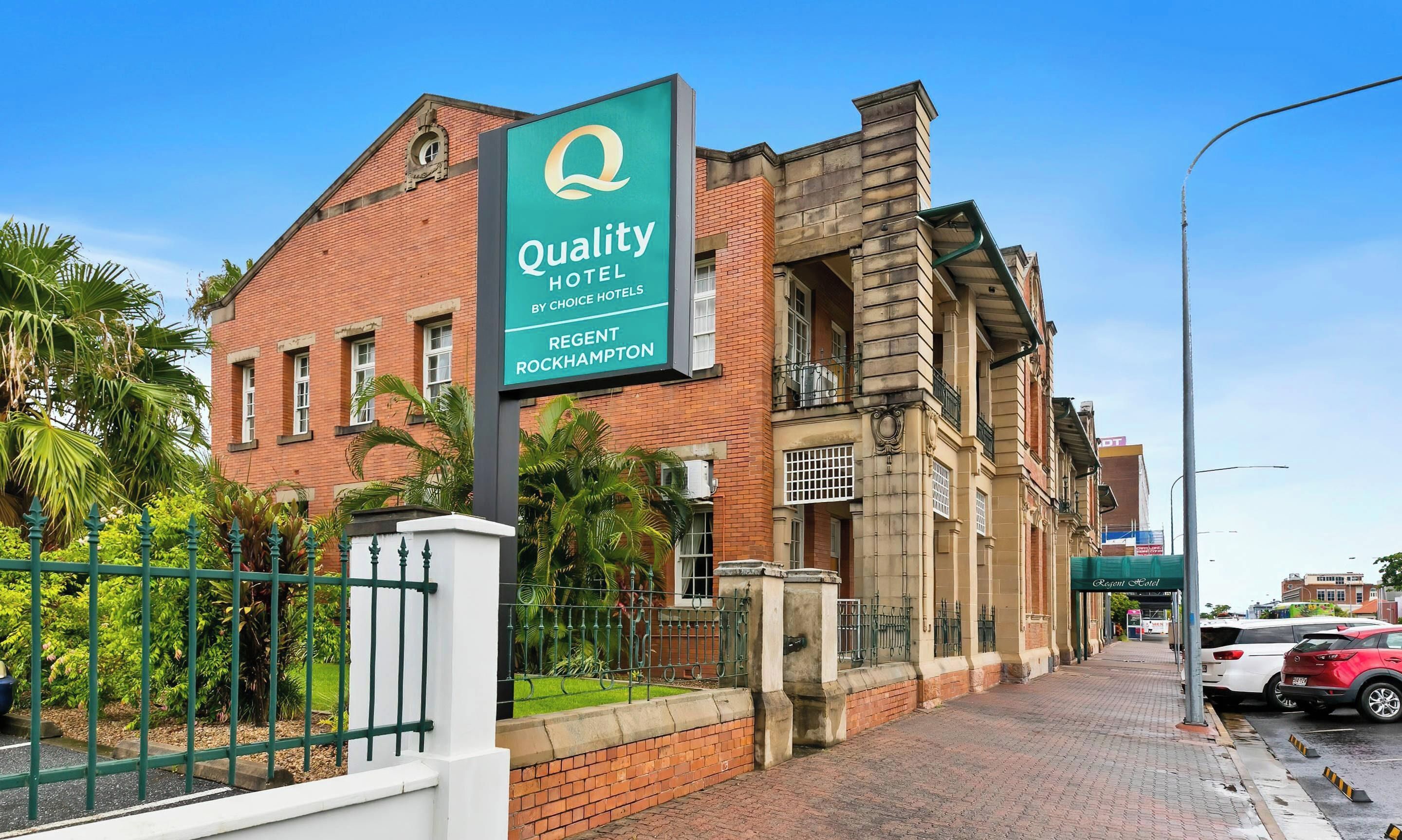 A hotel sign with a logo and name, indicating it's a Quality Hotel by Choice Hotels in Regent Rockhampton.