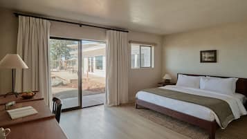 Premium bedding, desk, laptop workspace, blackout curtains