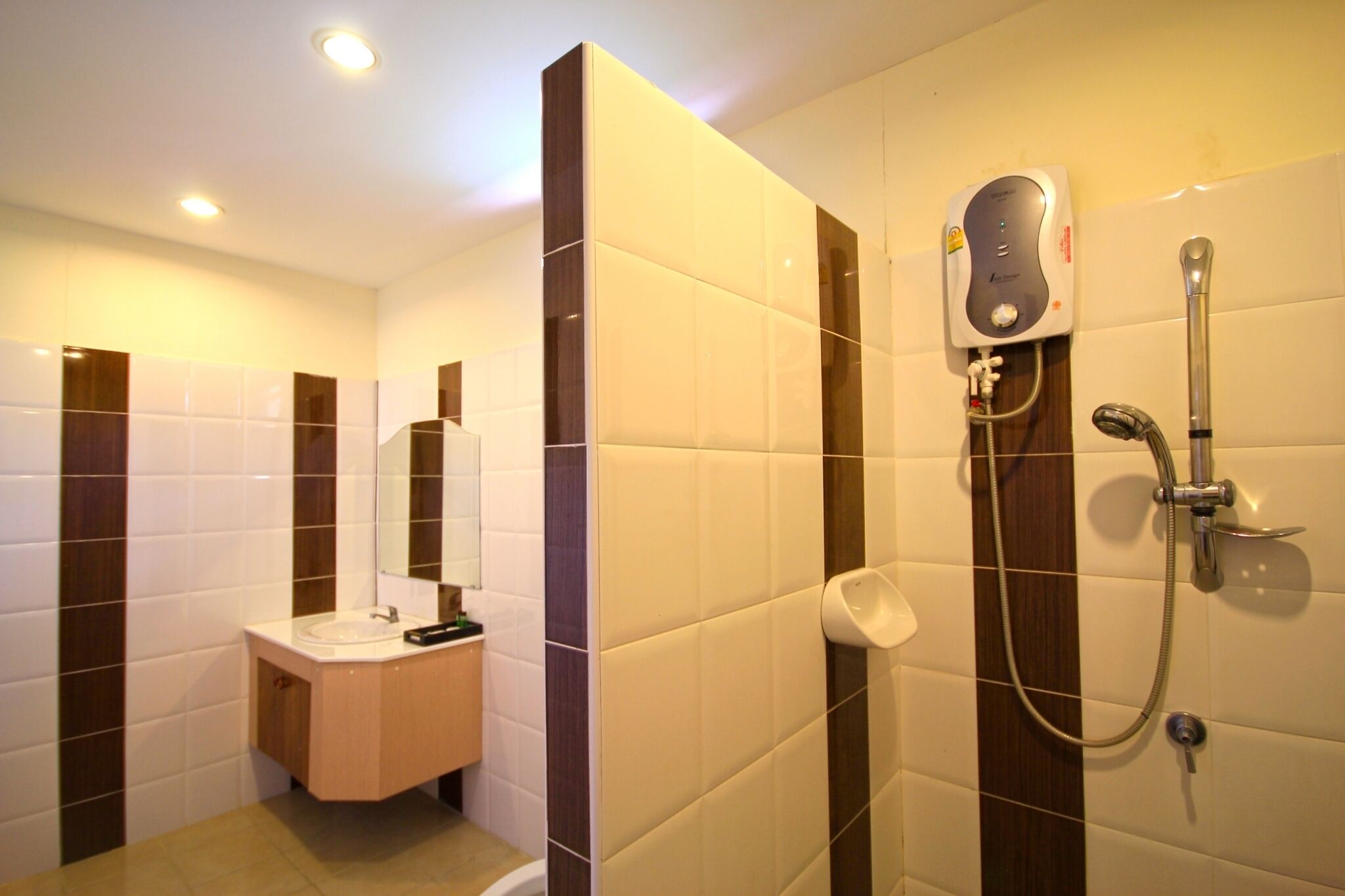 A modern bathroom with a sink, mirror, and shower.