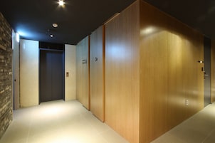 A hallway with wooden paneling, a tiled floor, and a door labeled "3F".