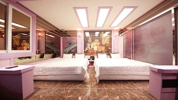Deluxe Family Room | Camas con efecto memoria, minibar y insonorización