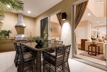 BBQ/picnic area at Magic Village Yards, Trademark Collection by Wyndham