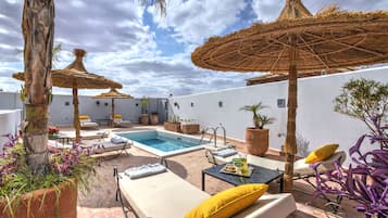 Outdoor pool, pool umbrellas, pool loungers