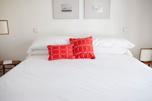 Premium bedding, down comforters, pillowtop beds, in-room safe