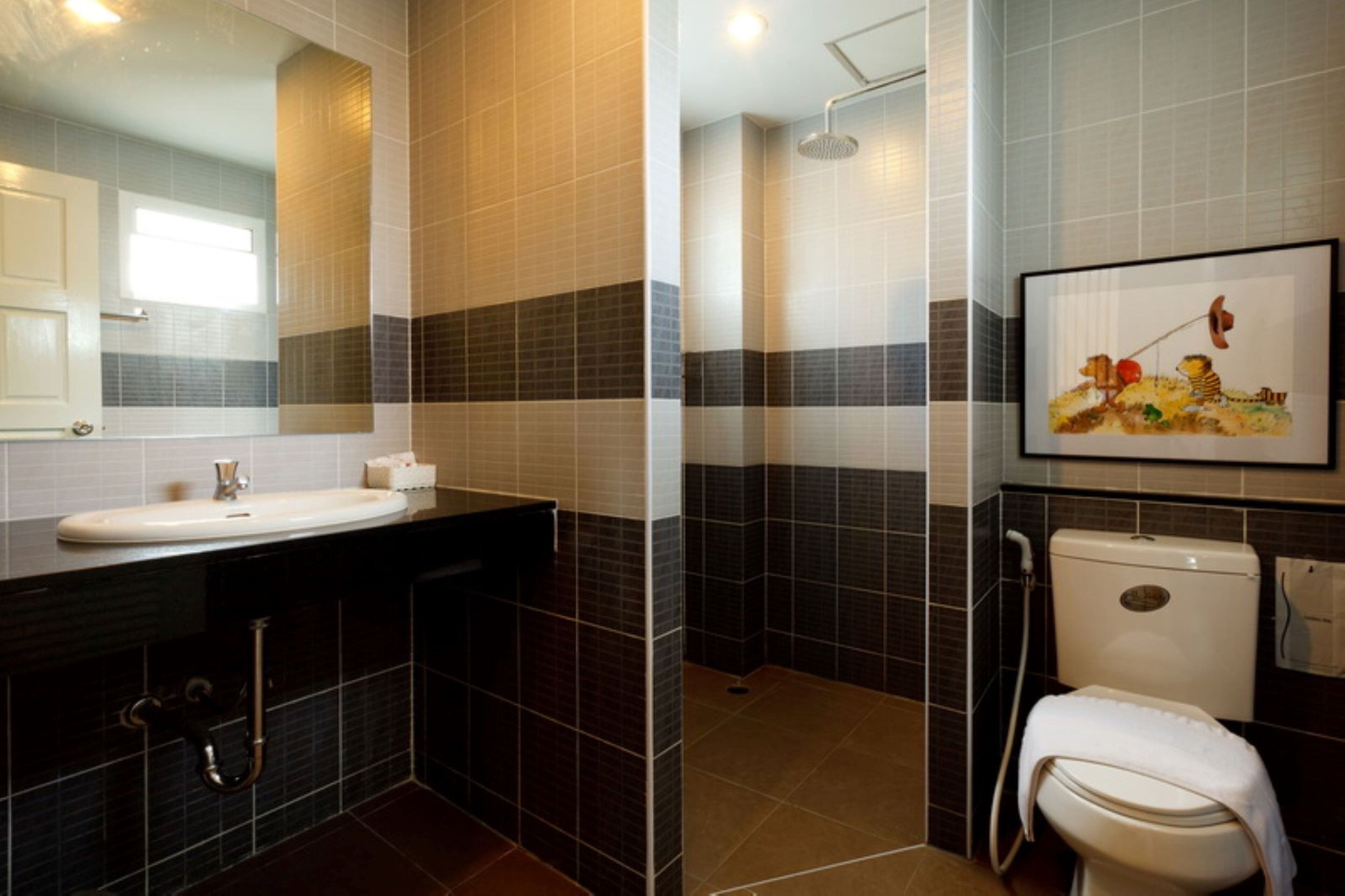 deluxe family room  | bathroom | shower, rainfall showerhead, free toiletries, hair dryer
