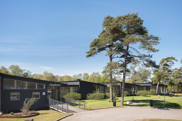 A modern building with a reception area, large windows, and a paved entrance. - Tyleback Hotell & Konferens, BW Signature Collection (Halmstad)