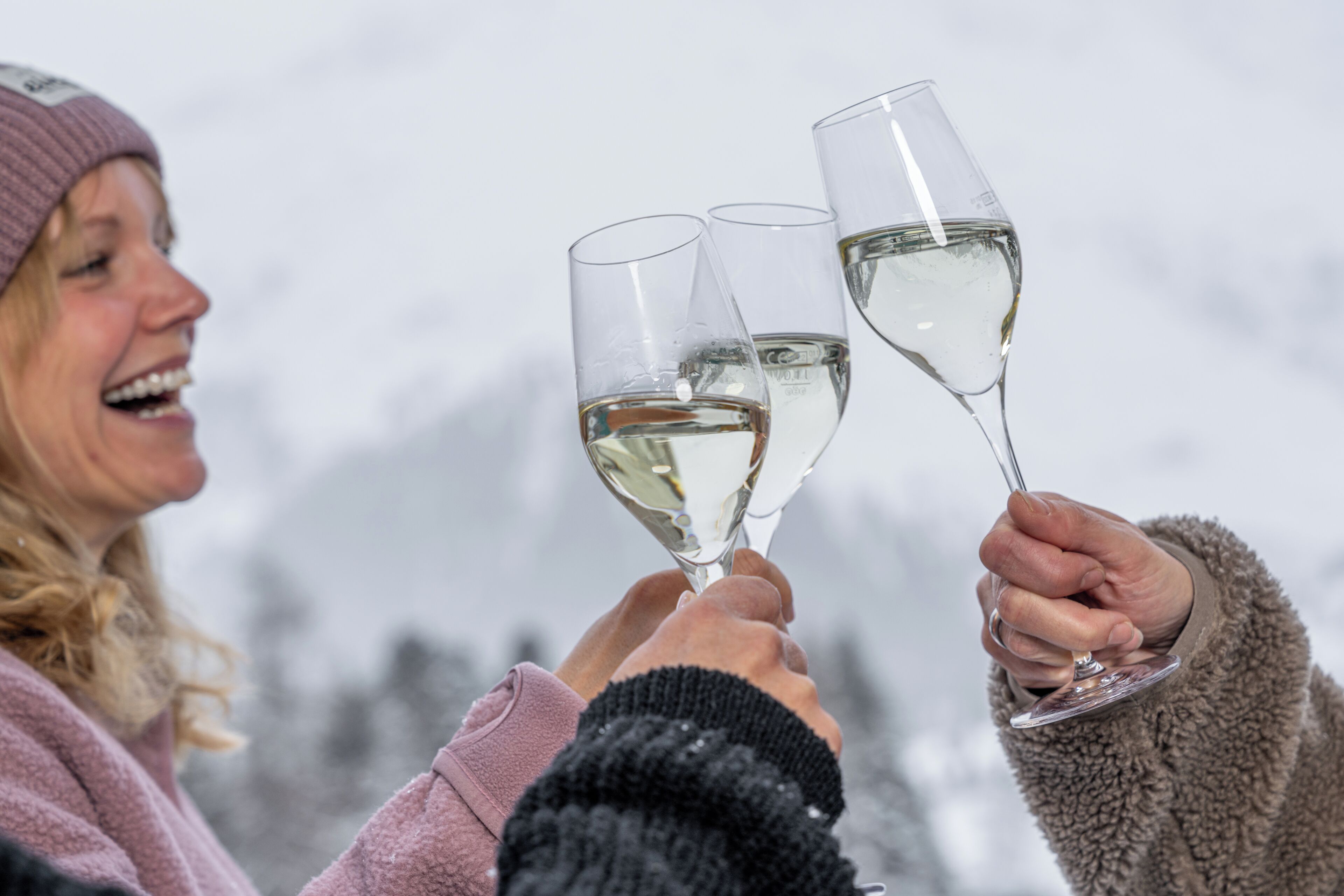 A person holding a wine glass.