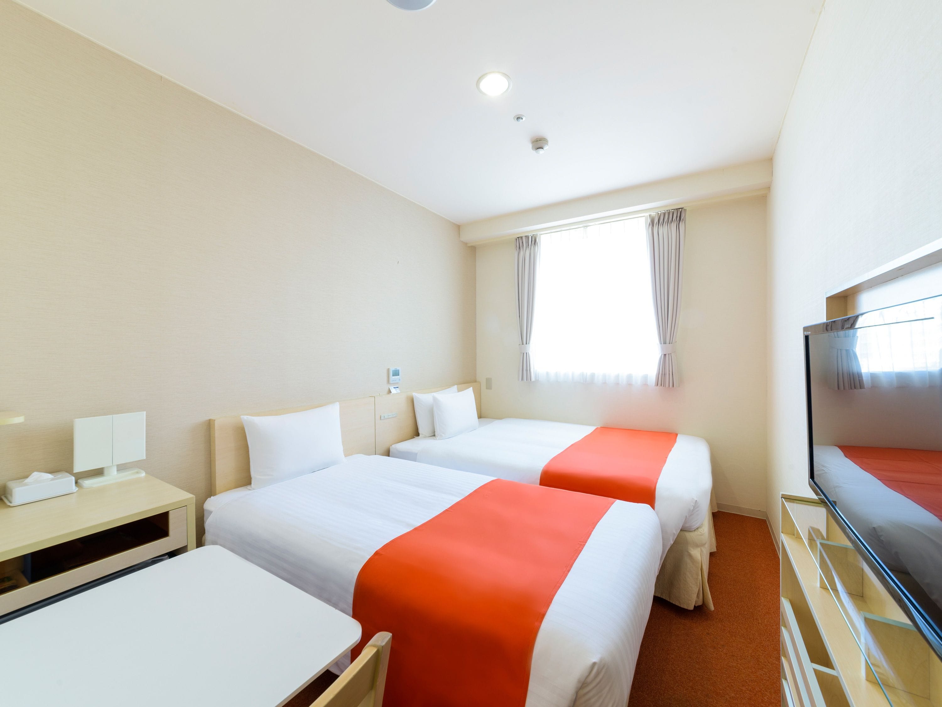 Premium bedding, desk, blackout drapes, iron/ironing board (on request)