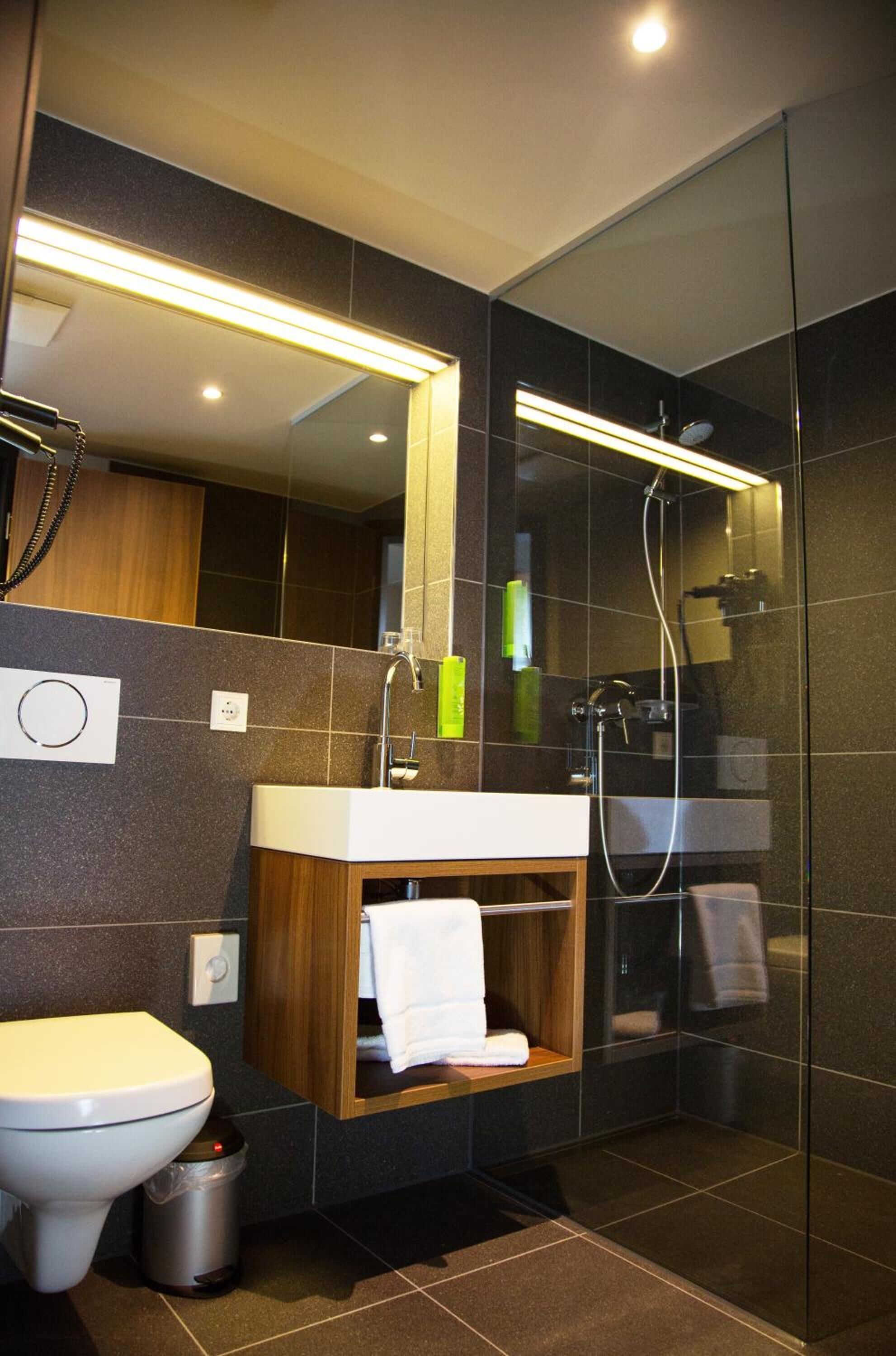 shower, hair dryer, heated floors, towels