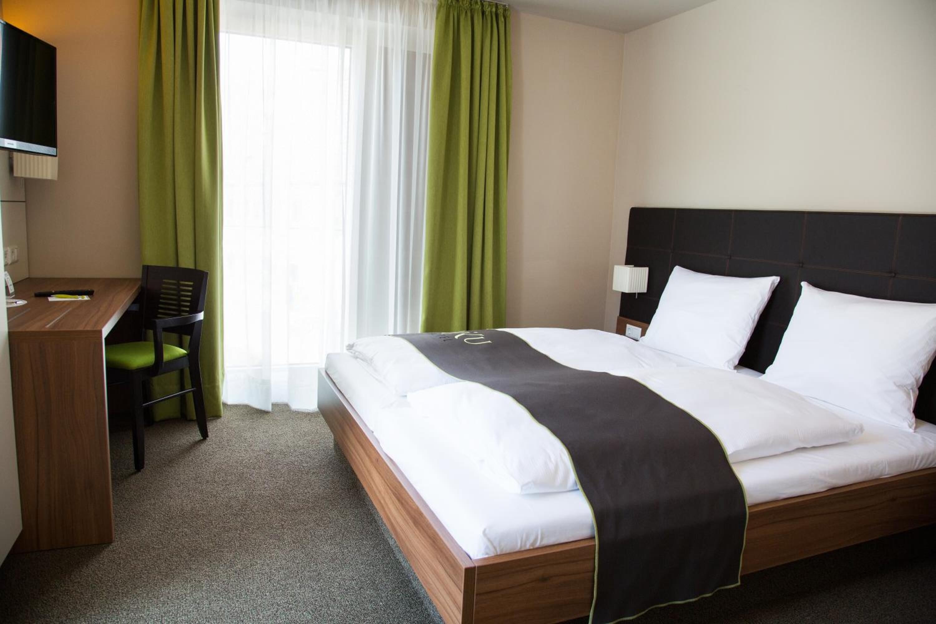 hypo-allergenic bedding, desk, blackout curtains, soundproofing