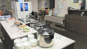 A buffet setup with various food items and serving utensils. - Hotel 1-2-3 Kokura (Kitakyushu)