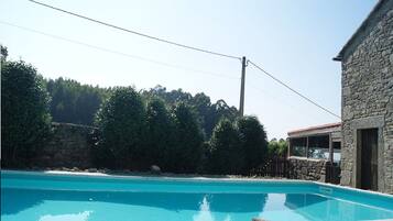 Seasonal outdoor pool, open 12:30 PM to 9:30 PM, pool umbrellas