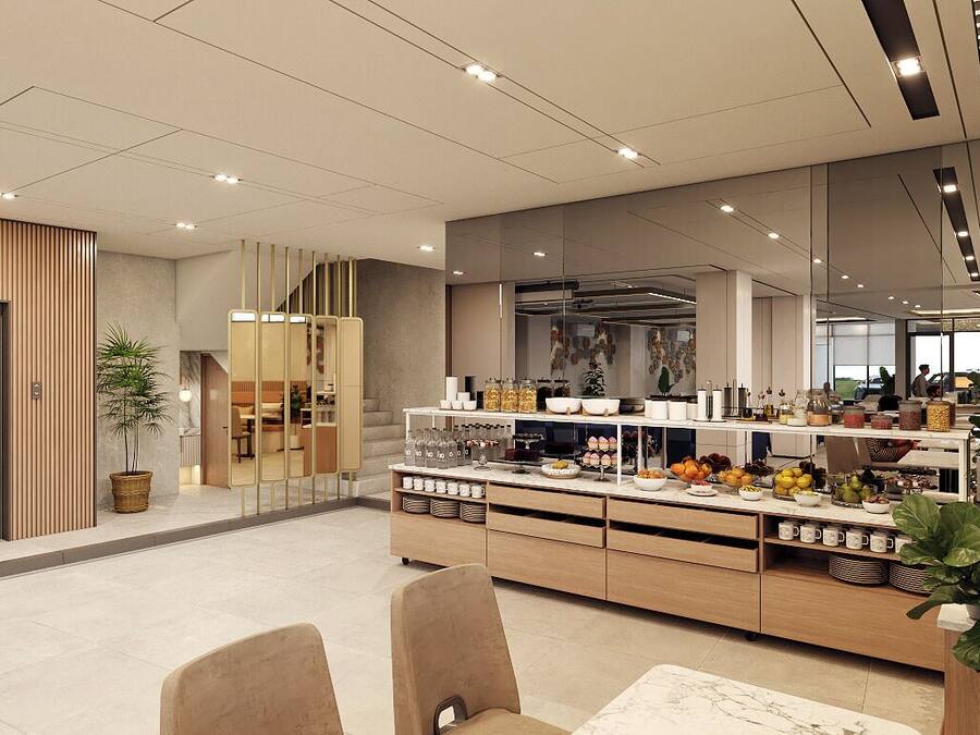 Un moderno vestíbulo de hotel con mostrador de recepción, un área de estar con sillas, una barra de buffet con comida y bebidas, y una escalera que sube a otro piso.